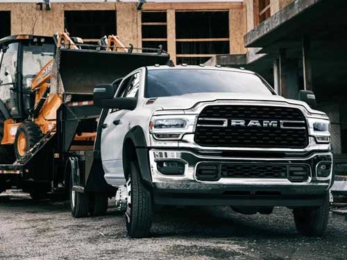 2024 RAM Chassis Cab towing a tractor