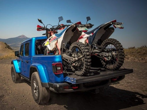 2025 Jeep Gladiator hauling two dirtbikes