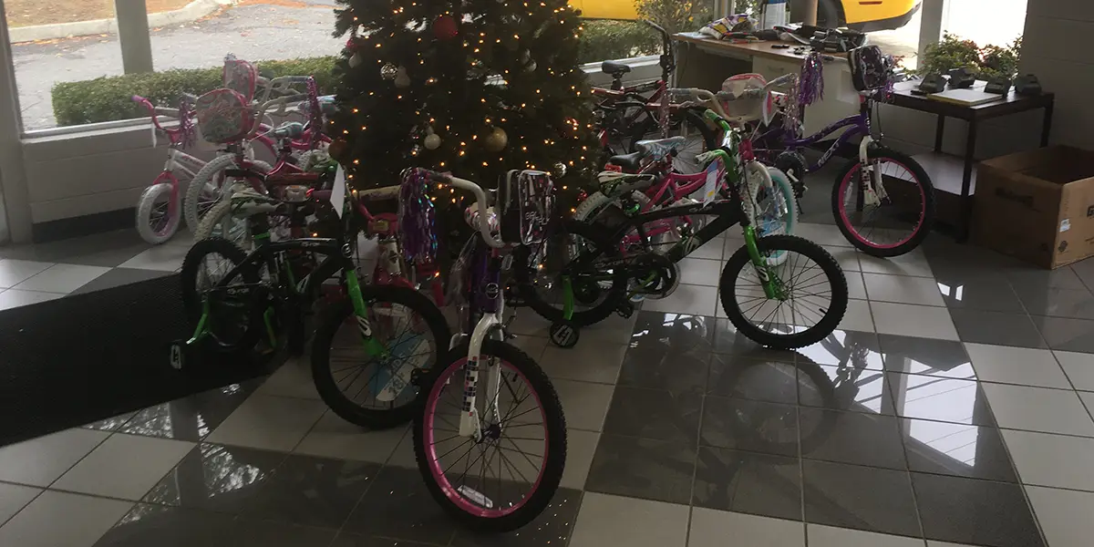Bikes for Kids infront Christmas tree